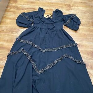 Joyfolie Elegant Black Dress with Gold Ruffle Details